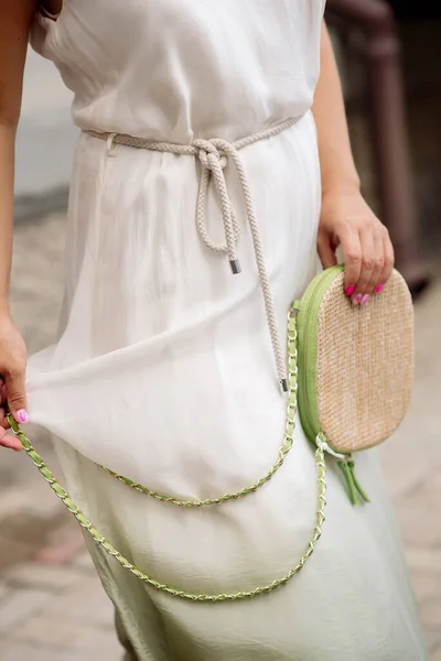 Summer bag Italian style in the hands of a woman