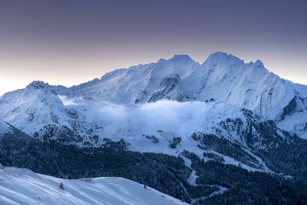 Sunrise over snow covered Alps in South Tyrol, Italy - Deep snow and blue sky