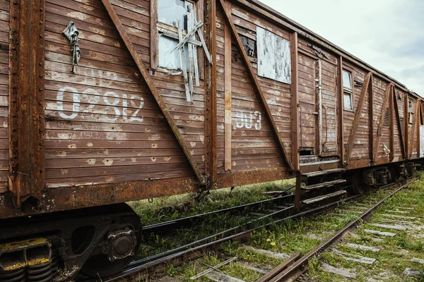 Old wooden transport wagon on the rails