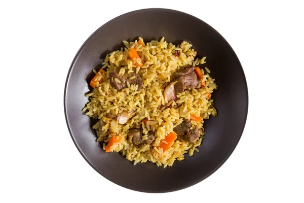 Pilaf with lamb, carrots, onions, garlic, pepper and barberry. A traditional dish of Asian cuisine. — Stock Photo, Image