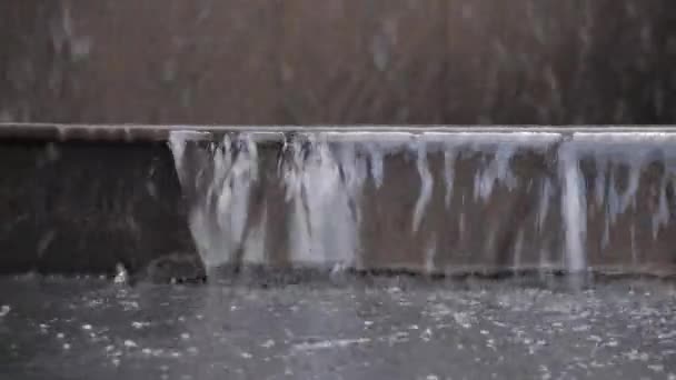 Close-up of water flowing down the stairs. Flooding in the city. Uncontrolled water on the streets. — Stock Video