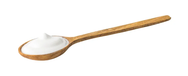 Joghurt auf Holzlöffel — Stockfoto