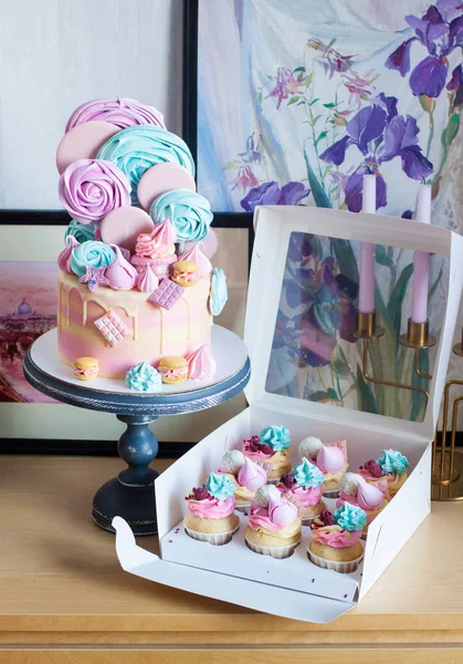 stock image Multi colored cake with melted chocolate, lollipops, meringue, candies, macaroons, biscuits, cake pops and cookies. 