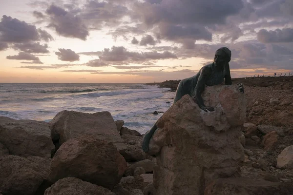 Sunset in Paphos, Cyprus. Sea and rocks, warm november day.