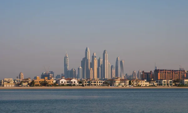 DUBAI, UAE - may 2019. View of various skyscrapers including Cayan Tower in Dubai Marina with stunning turquoise waters as foreground