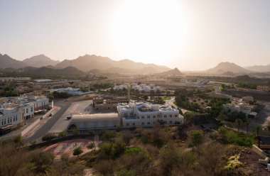 View from the top on town of Hatta and rocks in the background. Hatta is an enclave of Dubai in the Hajar Mountains, United Arab Emirates clipart