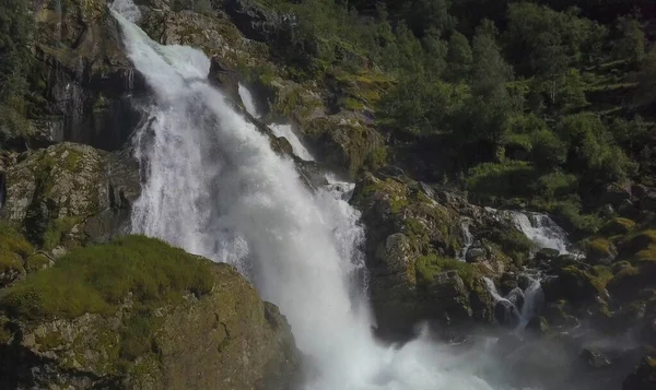 View to Kleivafossen waterfall on Briksdalselva river, Briksdalsbreen glacier, Norway. July 2019 — Stock Photo, Image