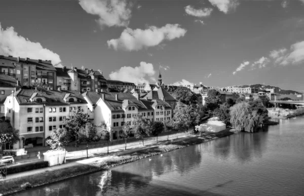 Maribor, Slovenia: Panorama of Maribor city, Slovenia. Drava River, buildings and mountains of Maribor. Black and white. — Stock Photo, Image