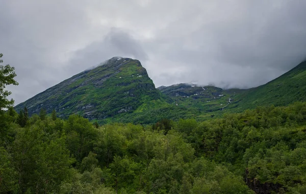 Mountain landscape near Norwegian fjord, Geiranger. Mountains and clouds. Beautiful Norwegian nature, Geiranger. July 2019
