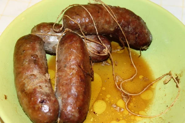 Pork sausages cooked in a pan ready to be served — Stock Photo, Image