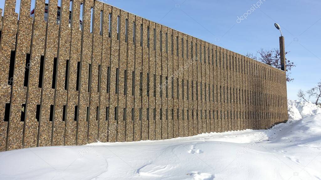 the exterior wall of a building in the snowy center of Kiruna in northern Sweden during the winter