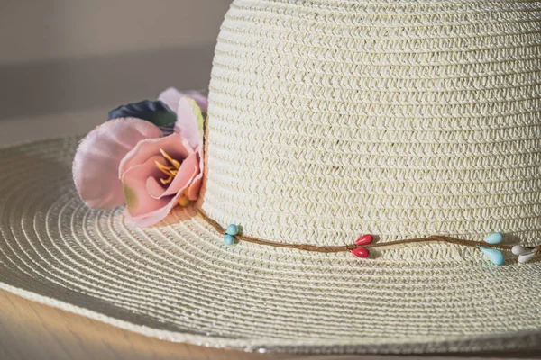 Summer straw hat symbolize vacations and traveling to warm countries. Color photo with copy space.