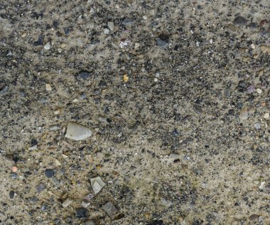 Taşlar, çakıl taşları ve çakıl taşlarıyla ıssız, boş toprağın yakın çekimi. Kıyametten sonraki dünya. Verimsiz toprak. yüksek kaliteli arkaplan, yüksek çözünürlüklü doku