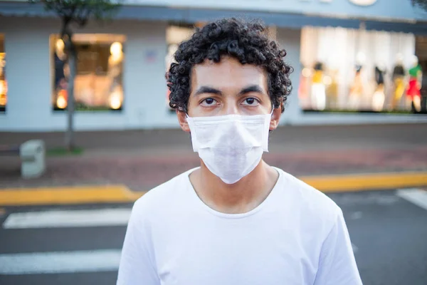 Closeup of a 22 year old man with protective mask