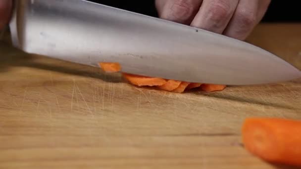 Woman Thinly Cuts Slices Carrots Kitchen Knife Wooden Board Close — Stock Video