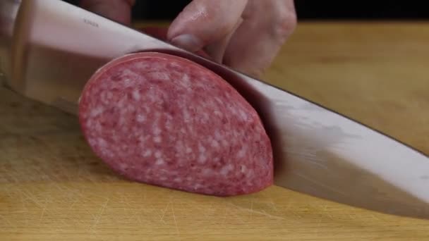 Woman Thinly Cuts Cooked Sausage Large Kitchen Knife Wooden Board — Stock Video