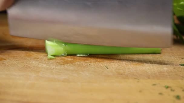 Woman Finely Cuts Celery Kitchen Cleaver Wooden Board Close — ストック動画