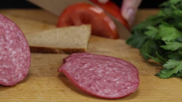 Woman Cuts Slice Tomato Puts Slice Gray Bread Close — ストック動画