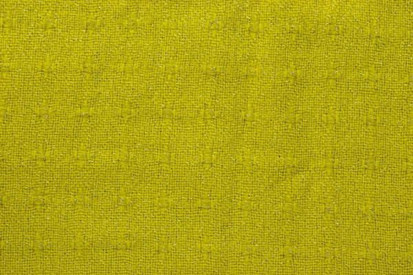 Achtergrond in de vorm van een gebreid materiaal van gele wol — Stockfoto