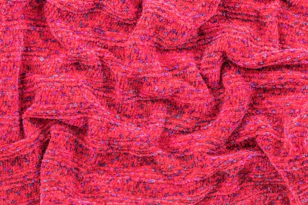 Background in the form of a knitted material from red wool — Stock Photo, Image