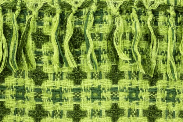 Latar belakang dalam bentuk material dari wol berwarna hijau cerah — Stok Foto