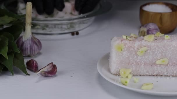 Foreground Large Piece Salted Lard Garlic Lies White Plate Background — 비디오