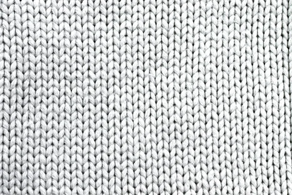 Fondo en forma de un producto de lana de punto blanco — Foto de Stock