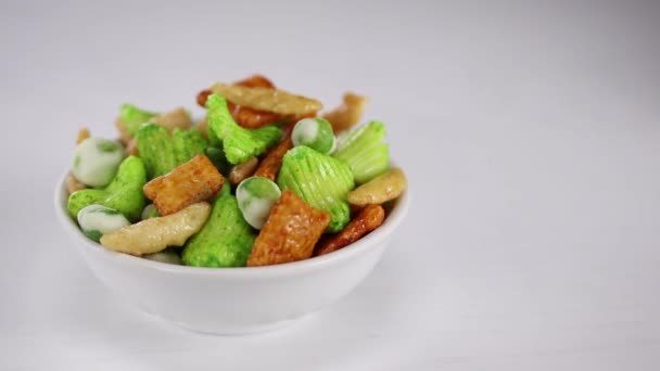 Japanese Sharp Snacks Peas Wasabi Lie White Bowl Foreground Background — Stock Video