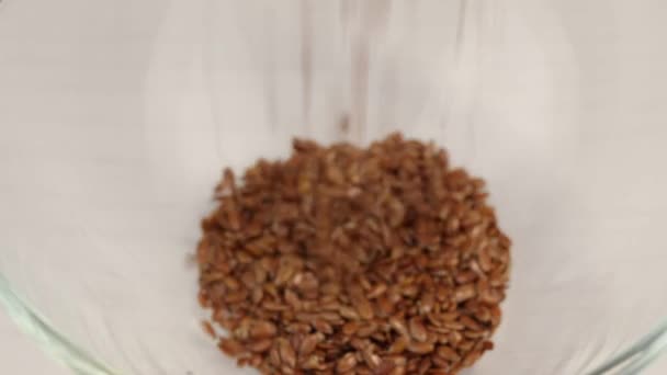 Flax Seeds Fall Glass Transparent Bowl Close — Stock Video