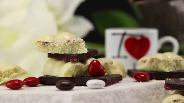 Pieces White Dark Chocolate Foreground Background Someone Pouring Black Coffee — Stock Video