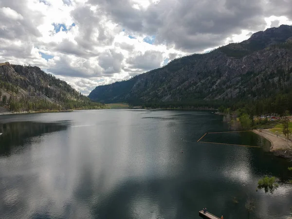 stock image Tremendous aerial photography of picturesque Alta Lake State Park with  an amazing and bright blue sky cumulus clouds reflecting in the water with a semi desert terrain and mountains in washington