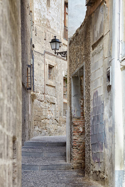 A narrow street in the Moorish quarter of Albaicin in Granada, Spain