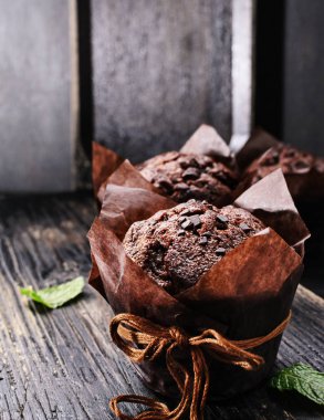 Chocolate muffins on table clipart