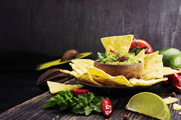 Guacamole on wooden table. — Stock Photo, Image