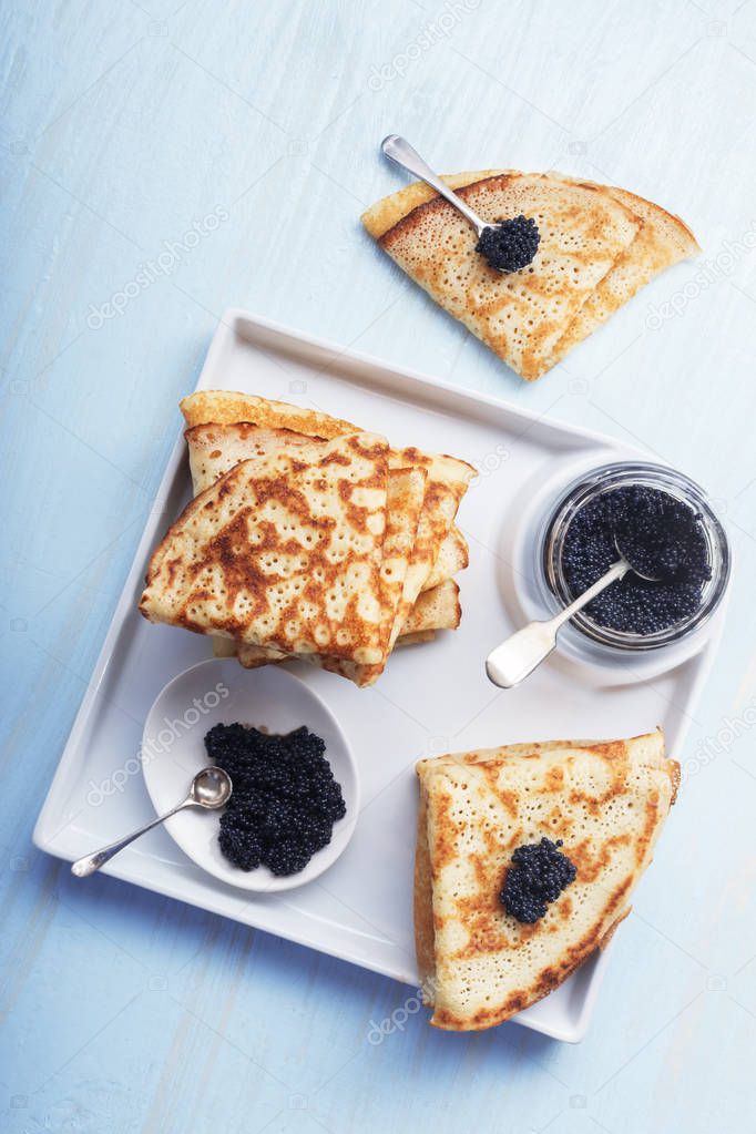  pancakes with black caviar 