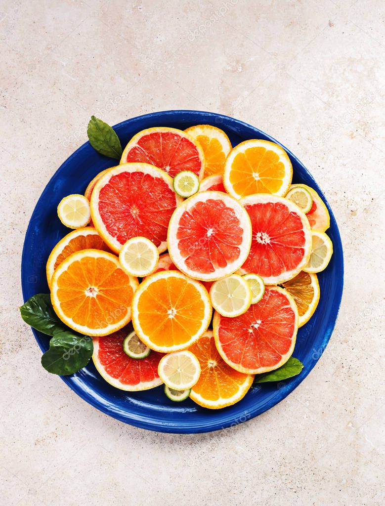 Variety  sliced citrus fruits. 