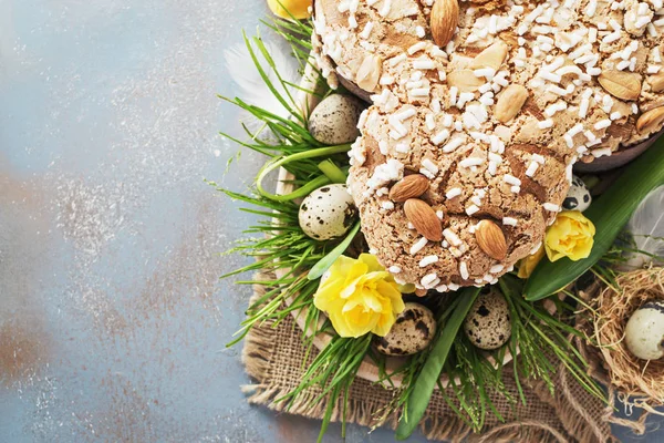 Colomba - italian easter dove cake on old rustic cyan wooden board. Selective focus, free text space.