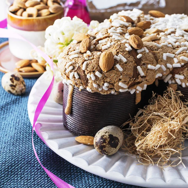 Colomba - italian easter dove cake on old rustic cyan wooden board. Selective focus, free text space.