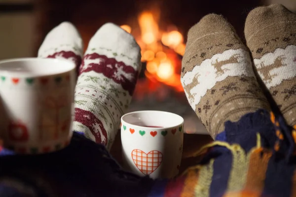 Man Woman Warm Knitted Socks Cups Hot Punch Front Fireplace — Stock Photo, Image