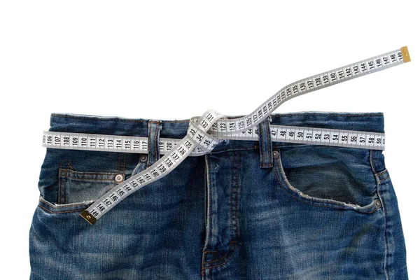Ölçüm bandıyla kot pantolon. Kilo verme konsepti