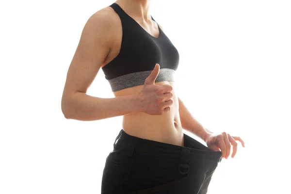 ダイエットと減量の概念 白い背景に大きなジーンズの女性 — ストック写真