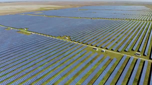 Aerial flying over a huge solar power plant. Aerial shot taken by drone — Stock Video