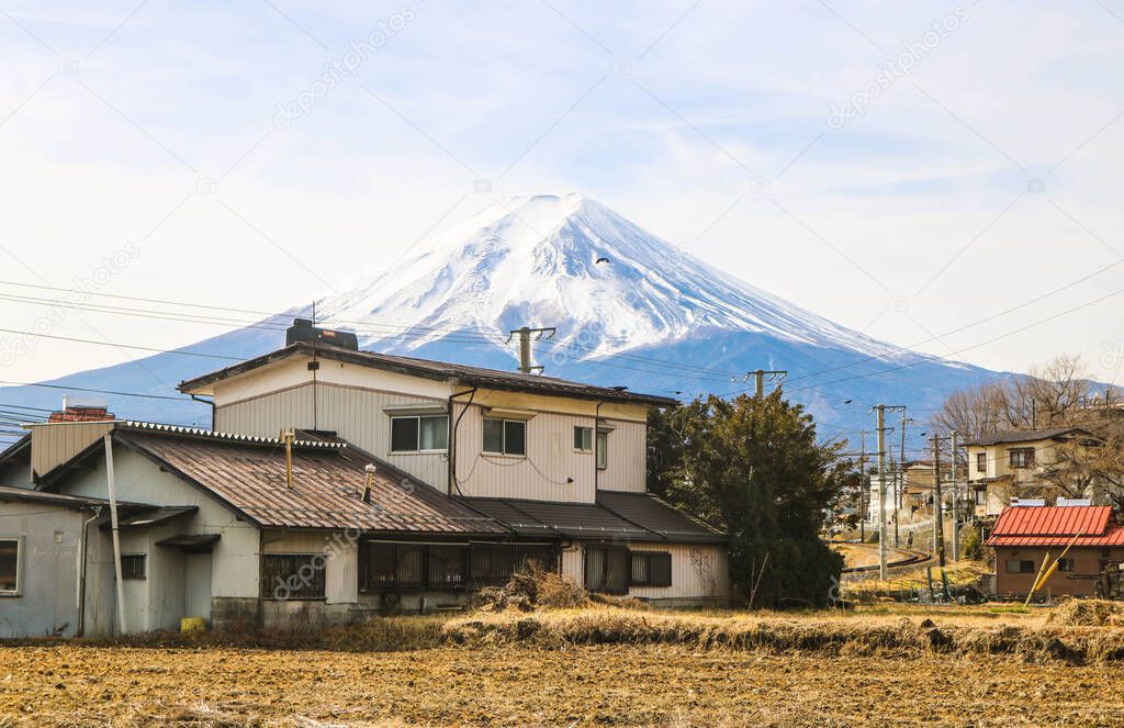 Beautiful landscape Mt.Fuji with japanese house in winter season in the morning, Fujiyoshida, Yamanashi, Japan. Travel concept