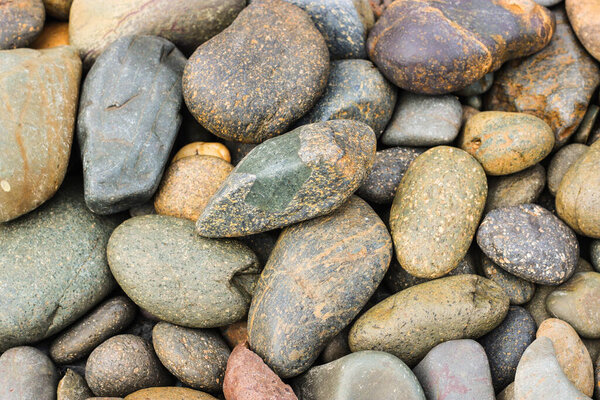 pebbles stone beach on the floor, pebbles stone background texture.