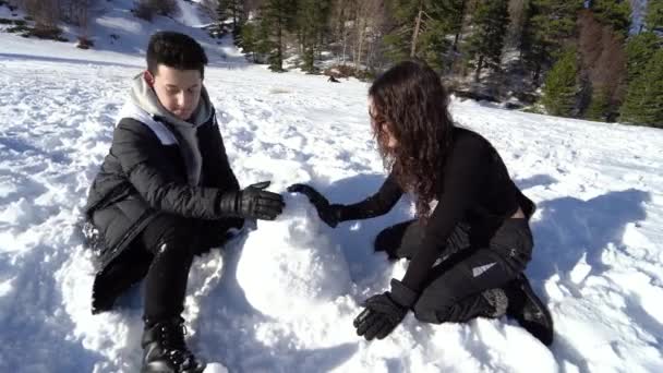 Girl Boy Making Snowman Mountains Happy Couple Joking Snow — Stock Video