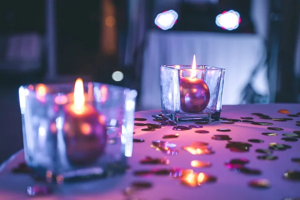 Details of  candles on the restaurant table, bokeh of light