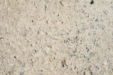 Serpiştirilmiş taşlar arka plan beton yüzey yakın çekim