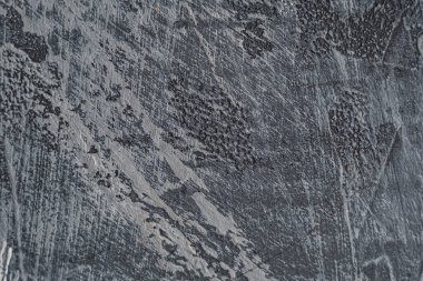 Arka plan beton dokusu, bir sürü çizik, boya lekesi ve çıkıntısı var. gri renk.