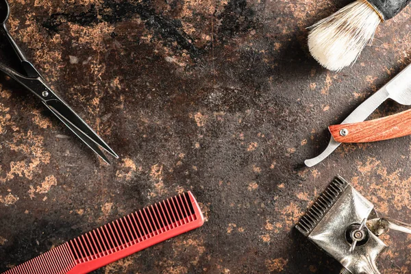 stock image hairdressing scissors vintage manual clipper comb brush dangerous razor are on a on a rusty old beautiful surface.