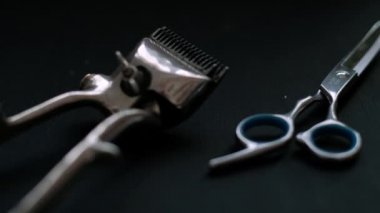 vintage barber tools dangerous razor hairdressing scissors old manual clipper comb shaving brush. on black background